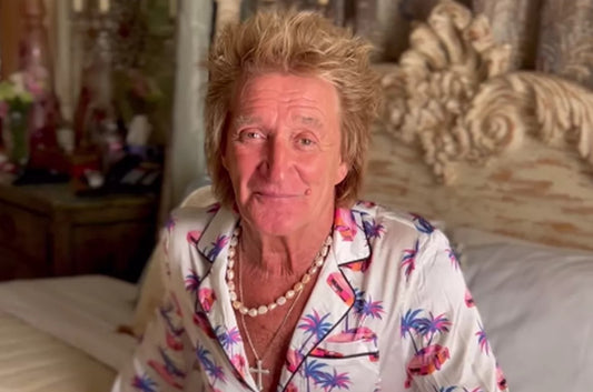The Story Behind Rod Stewart’s Snazzy Pink Satin Pyjamas and Pearl Necklace