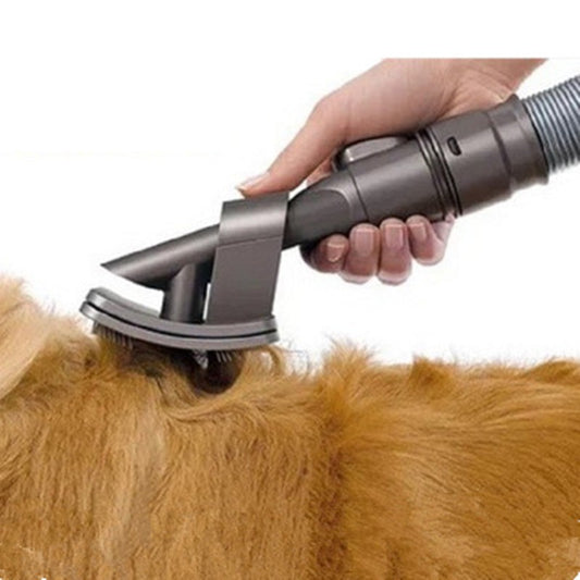 Vacuum-assisted pet grooming tool removes loose hair directly into the vacuum